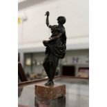A small classical bronze figure on a marble base.