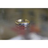 An 18ct gold, platinum, diamond and sapphire ring.