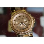 A Michael Kors rose gold coloured chronograph style wristwatch.