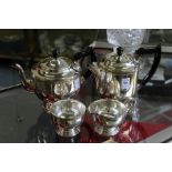 A plated four piece tea service.