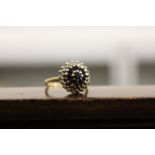 A good gold, diamond and sapphire cluster ring.