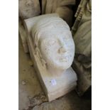 A large reconstituted stone human head corbel.