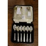 A cased set of six silver coffee spoons and two silver mounted cut glass jars.