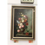 A still life of flowers in a vase on a ledge, oil on canvas.