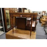 A George III mahogany D-shaped foldover card table on turned legs with brass castors.