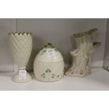 A Belleek porcelain honey jar modelled as a bee skep, together with a rootwood style vase and