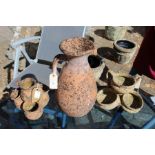 A terracotta jug and two small garden urn shaped planters.