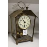 A small brass case clock.