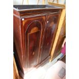 An Edwardian inlaid mahogany wardrobe.