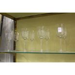 A set of eight cut glass wine glasses.