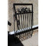 A wrought iron garden gate.