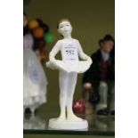 A Royal Doulton figure of a ballerina.