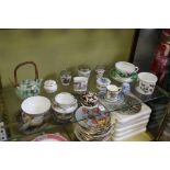 A collection of small porcelain items to include Port Meirion bowl, golfing cup and saucer etc.