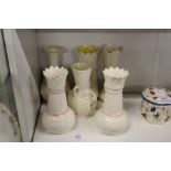 A collection of Belleek porcelain vases.