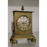 A small brass case carriage clock.