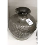 An Art Nouveau pewter vase.