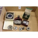 A decorative scent bottle, miniature picture frame and other ornamental items.
