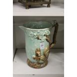 A pottery squirrel jug.