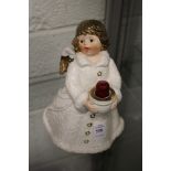 A Goebel candle holder modelled as an angel holding a bowl.