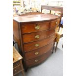 A large Victorian mahogany bow front chest of drawers.