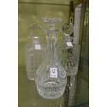 Two cut glass whisky decanters and a sherry decanter.
