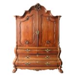 AN 18TH CENTURY DUTCH MAHOGANY BOMBE CUPBOARD, with shell carved arched cornice, pair of panelled