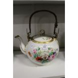 A floral decorated teapot.