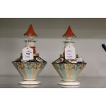 A pair of continental porcelain perfume bottles painted with birds and insects.