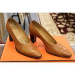 A pair of Hermes small heeled pumps, leather shoes complete with dust bag and original box.