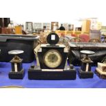 An Art Deco three piece clock garniture.