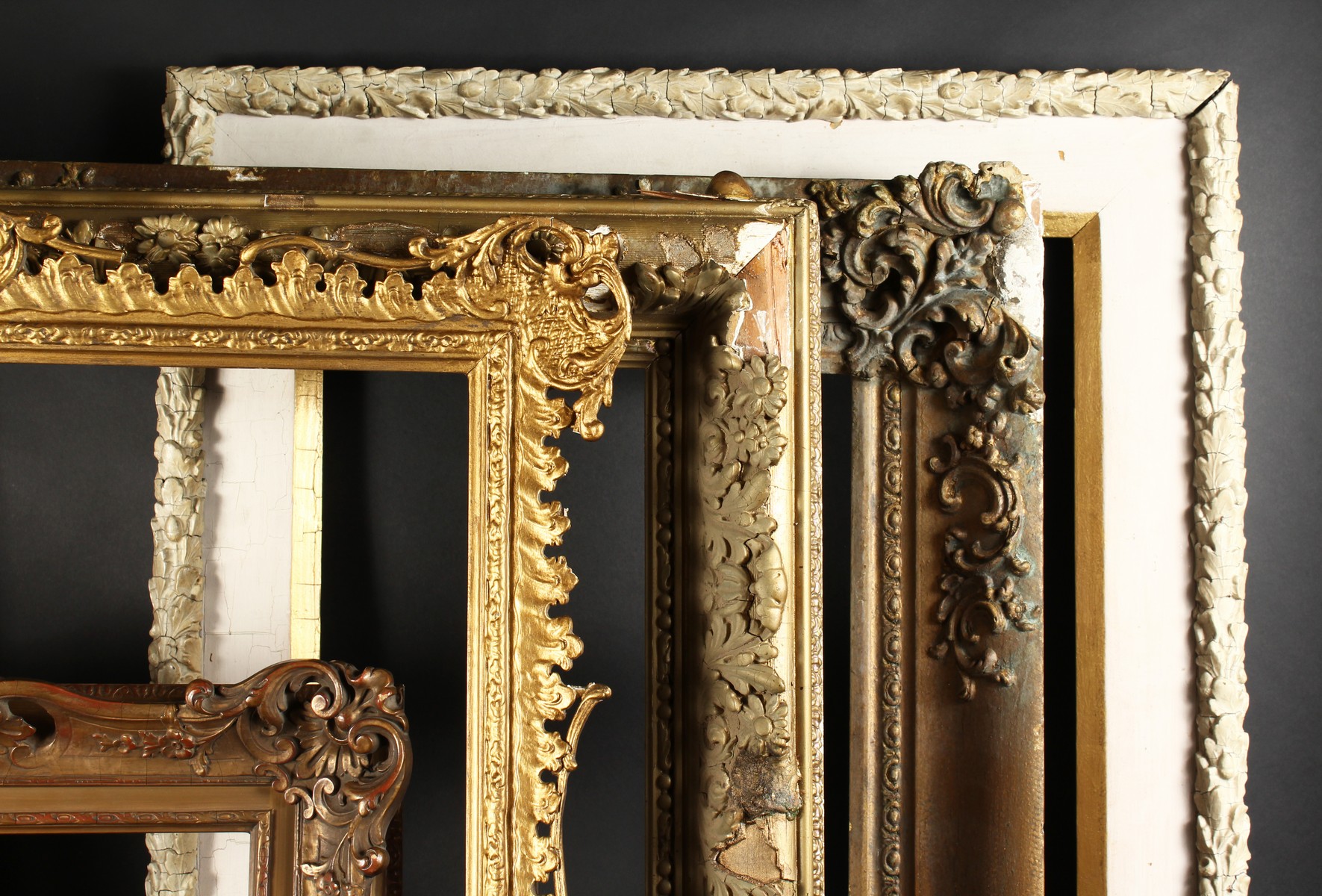A 19th Century English Gilt Composition Frame, 25" x 30" - 63.5cm x 76.25cm. And Four other Frames