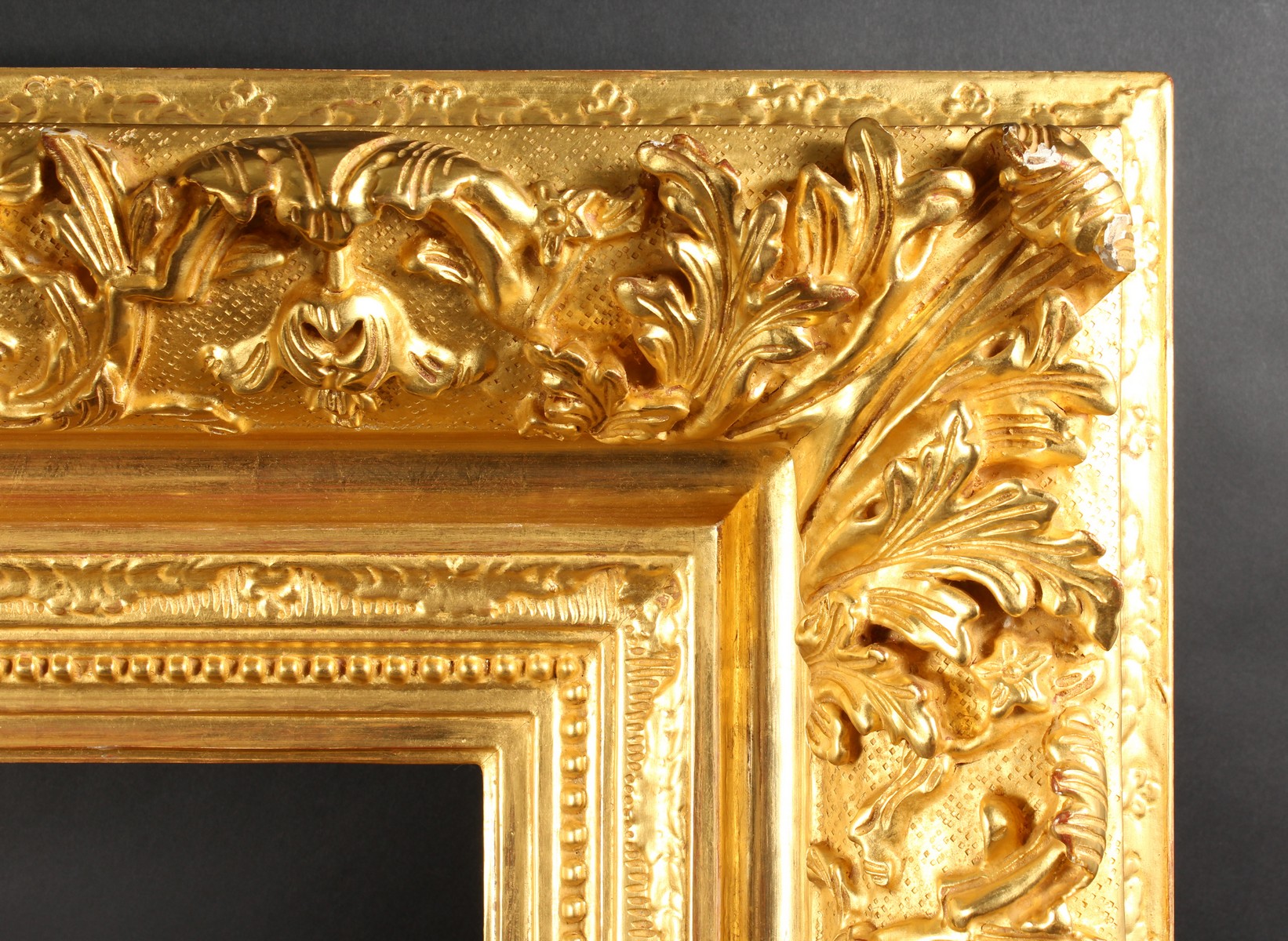 A 19th Century French Gilt Composition Frame with Scrolled Corners. 22" x 18" - 56cm x 45.75cm. (