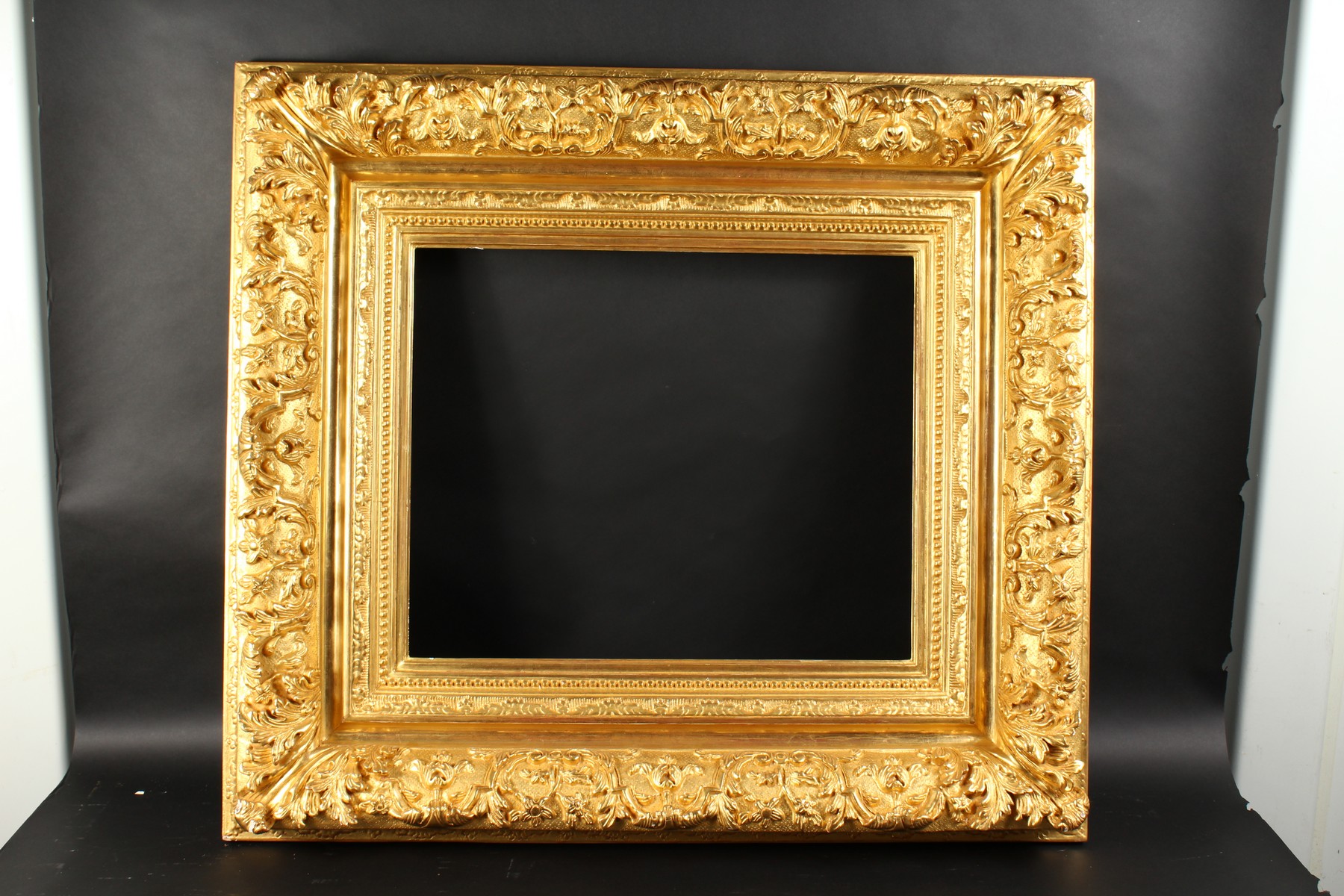 A 19th Century French Gilt Composition Frame with Scrolled Corners. 22" x 18" - 56cm x 45.75cm. ( - Image 2 of 3