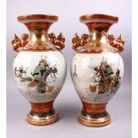 A GOOD PAIR OF JAPANESE MEIJI PERIOD KUTANI PORCELAIN VASES, each decorated with native landscape