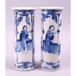 A PAIR OF CHINESE KANGXI BLUE & WHITE PORCELAIN SLEEVE VASES, both decorated with scenes of