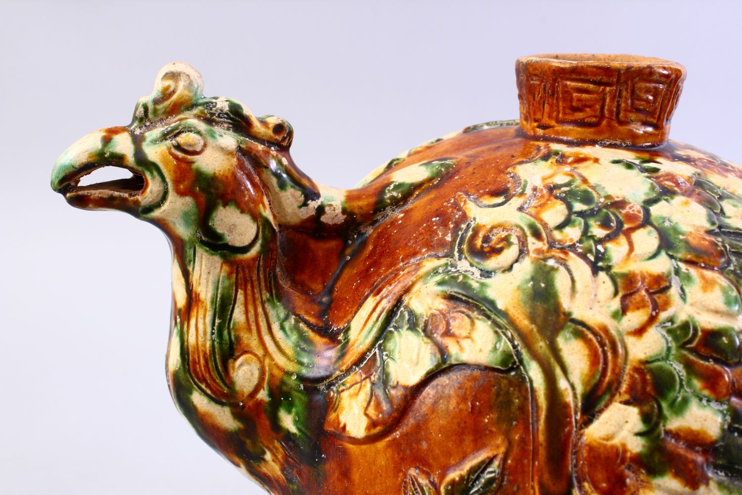 A LARGE CHINESE SANCAI GLAZED TANG STYLE POTTERY EWER, with carved and moulded decoration of a - Image 6 of 8