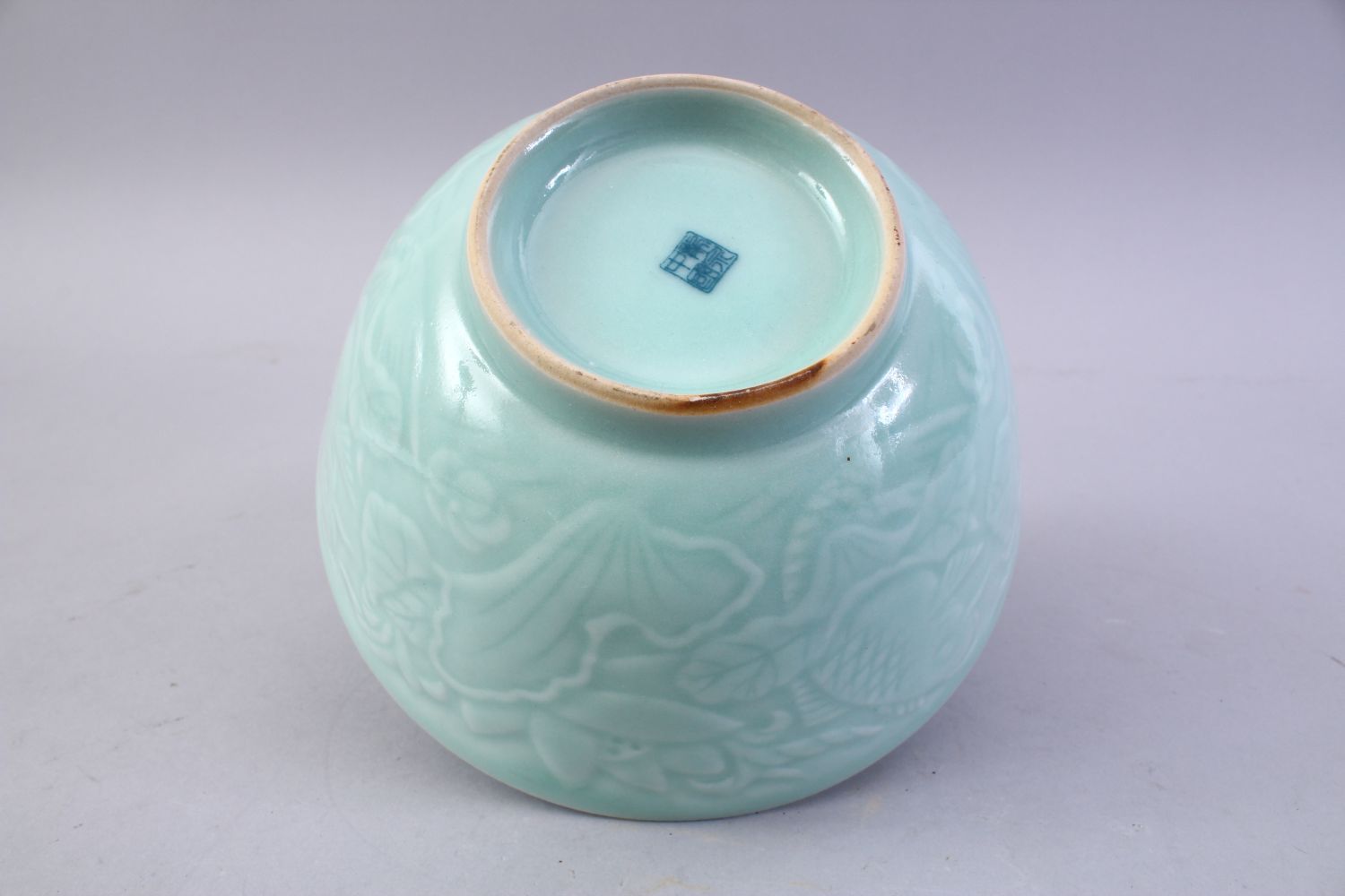 A CHINESE CELADON MOULDED PORCELAIN CARP BOWL, the bowl with carved decoration of fish and lotus, - Image 7 of 8