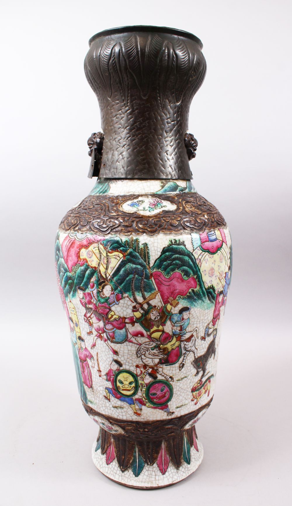 A 19TH CENTURY CHINESE FAMILLE ROSE CRACKLE GLAZED PORCELAIN VASE, painted with a battle scene,