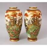 A GOOD PAIR OF JAPANESE MEIJI PERIOD CERAMIC VASES, each vase upon a beige ground with typical