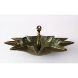 AN UNUSUAL 19TH CENTURY OR EARLIER ISLAMIC BRASS HANGING OIL LAMP, the underside with chased