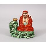 A GOOD JAPANESE MEIJI PERIOD KUTANI PORCELAIN JOSS STICK HOLDER, of a seated arhat with his