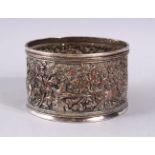 A GOOD ELKINGTON INDIAN SCENE SILVERED BOTTLE COASTER, with hunting scenes and floral decoration,