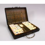 A CHINESE LEATHER STYLE MAHJONG DRAGON GAMES SET, with decoration of a dragon and incomplete ,