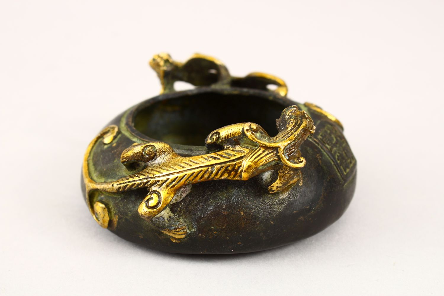 A 20TH CENTURY CHINESE BRONZE TWIN HANDLE CENSER, the censer with moulded gilded handles in the form - Image 4 of 5