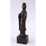 A CHINESE BRONZE FIGURE OF GUANYIN, in traditional robes, on a fitted base, 15cm ( excluding