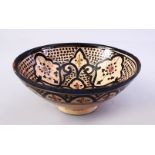 A GOOD ISLAMIC SIGNED POTTERY BOWL - SAFI, the interior decorated with formal floral design, the