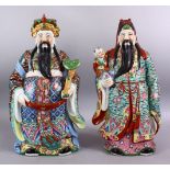 A LARGE PAIR OF 20TH CENTURY CHINESE FAMILLE ROSE IMMORTAL FIGURES, one holding a scepter, the other