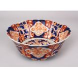 A GOOD JAPANESE MEIJI PERIOD IMARI TRIPLE FOOT MOULDED PORCELAIN BOWL, the bowl decorated with