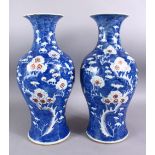 A PAIR OF 19TH CENTURY CHINESE BLUE & WHITE PORCELAIN PRUNUS VASES, each with prunus decoration, the