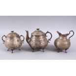 A GOOD 19TH CENTURY PERSIAN SILVER TEA SET, comprising a tea pot, 14cm high x 16cm wide, a cream jug